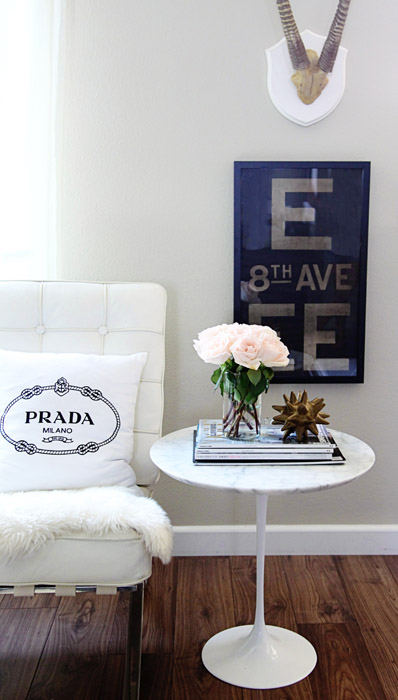 7-small-shop-for-Adore-Home-by-Sabra-Lattos-living-room-Barcelona-chair-sheepskin-Prada-pillow-Saarinen-table-subway-sign